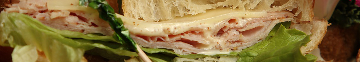Eating Deli Sandwich at New York Subs restaurant in Orange, CA.